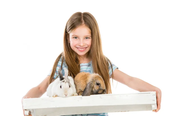 Little girl with rabbits — Stock Photo, Image