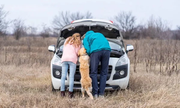 Daughter with dog helping father — Stock Photo, Image