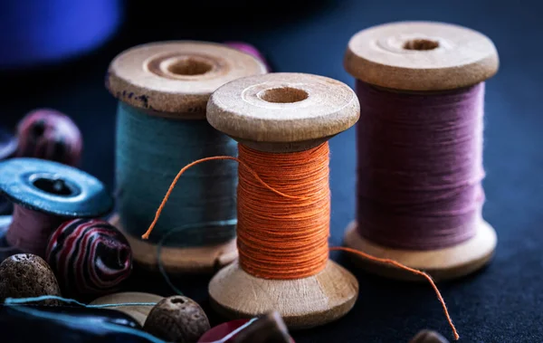 Retro threads on wooden bobbins — Stock Photo, Image