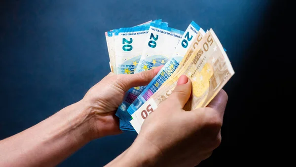 Hand holding banknotes — Stock Photo, Image