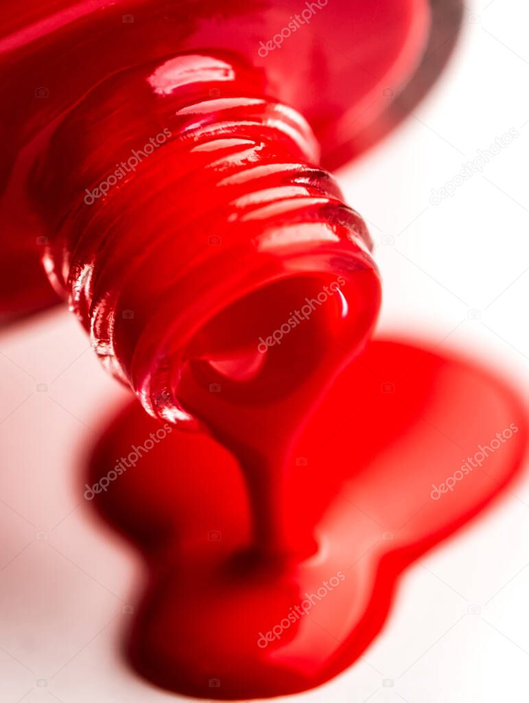 Pouring nail polish from bottle