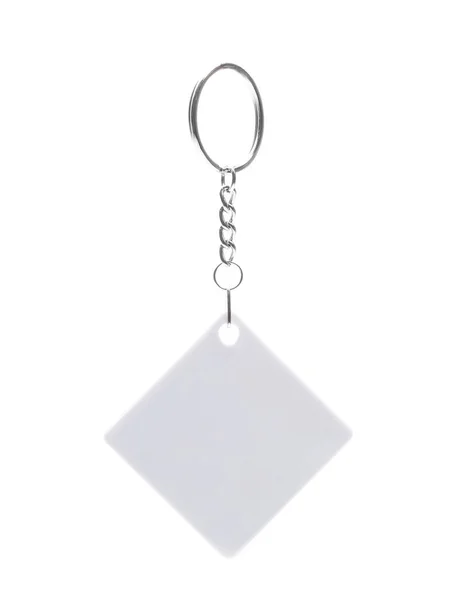 반지를 끼고 있는 흰 사각형의 열쇠 소지자 — 스톡 사진