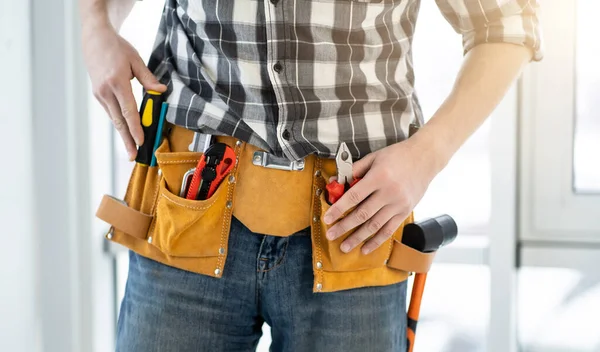 Fitter wearing belt with professional tools — Stock Photo, Image