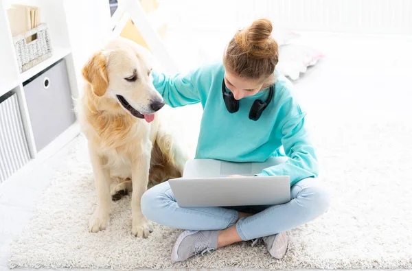 Nice Teenage Girl Working Computer Next Cute Dog — Zdjęcie stockowe