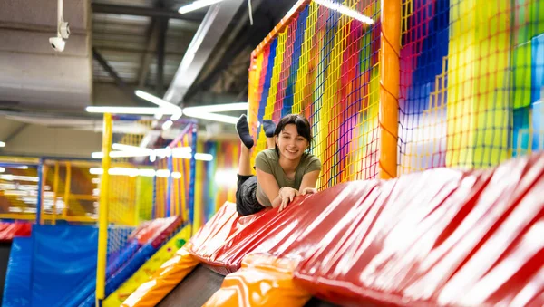 Pretty Girl Lying Colorful Trampoline Playground Park Smiling Beautiful Teenager — Stok fotoğraf
