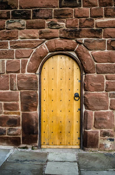 Wooden Door in Stone Wall — Stock Photo, Image