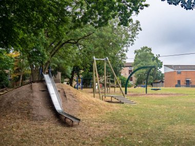Childrens playground. Hanworth, Bracknell, Berkshire UK. With slide, swings, roundabout