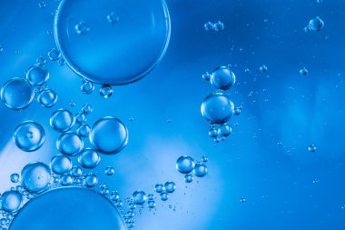 Abstract bubbles of oxygen floating towards the surface clipart