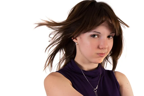 Chica joven con el viento soplado pelo — Foto de Stock