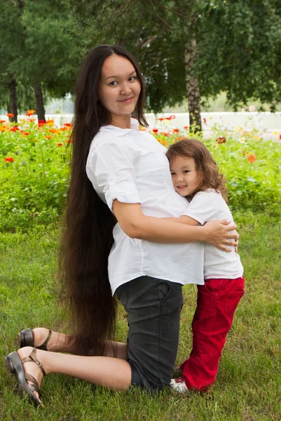 Pregnancy woman and her little daughter Royalty Free Stock Photos