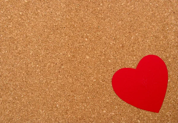 Red heart on pressured cork background — Stock Photo, Image