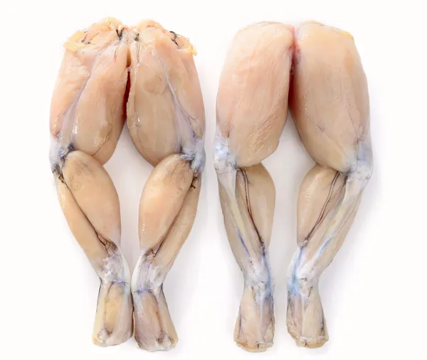 beyaz zemin üzerine taze kurbağa bacağı iki çift