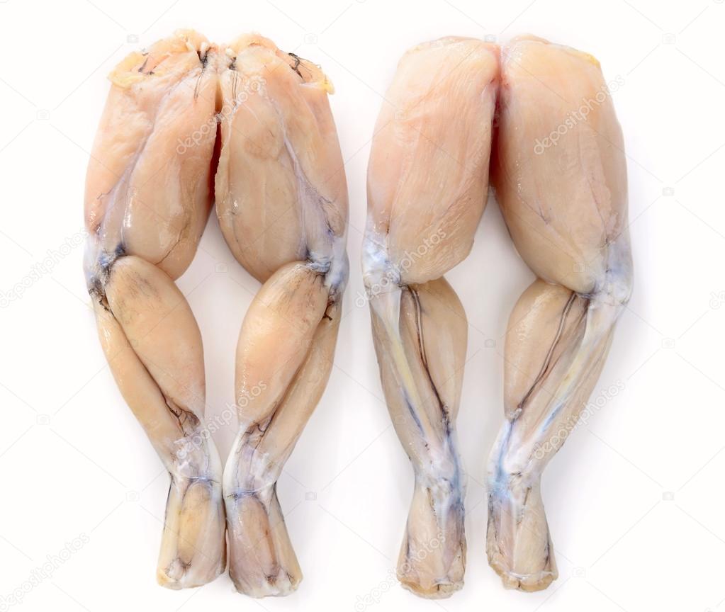 Two Pairs of Fresh Frog Legs on white background — Stock Photo © nelik