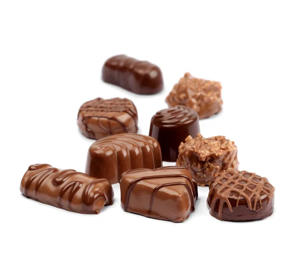 Chocolade assortiment op wit — Stockfoto