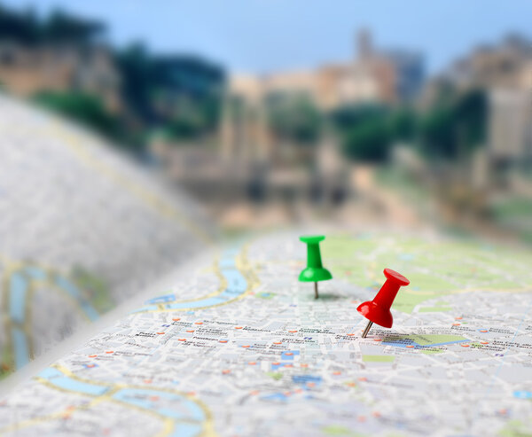 Travel destination map push pins blur