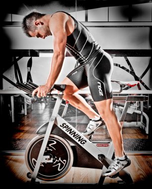 Athlete training in a gym clipart