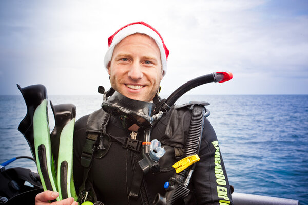 Smiling young man in scuba gear