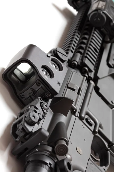 Modern tactical laser sght on assault carbine close-up. — Stock Photo, Image