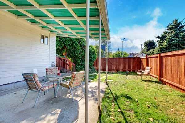 Backyard with chairs under the covered space. — Stock Photo, Image