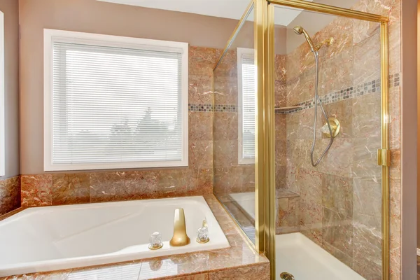 Luxury new granite shower and tub with gold metal. — Stock Photo, Image