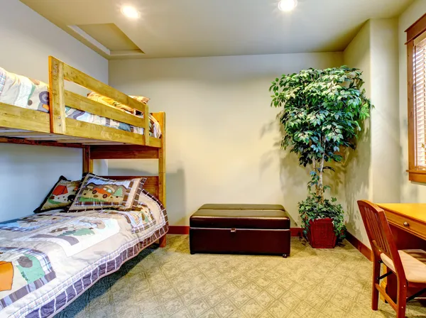 Bedroom with children double bed with desk. — Stok fotoğraf