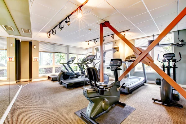 Gym in apartment building with mirror. — Stock Photo, Image