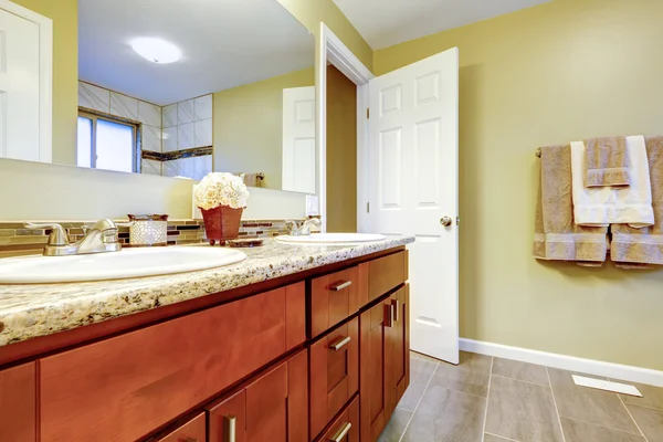 New bathroom interior with cherry sink cabinet. — Stock Photo, Image