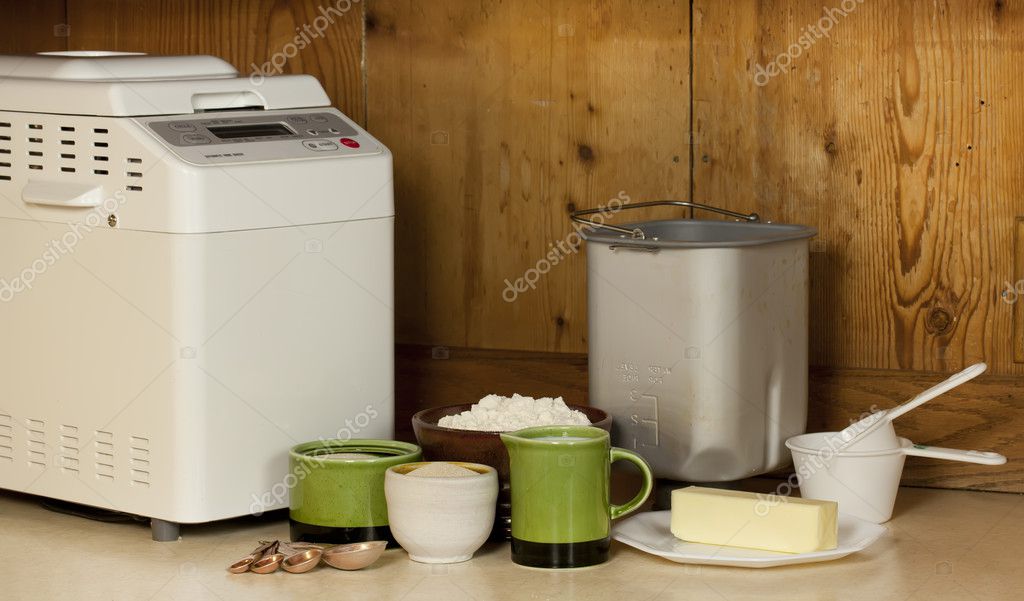 Bread making machine at home with ingredients for baking. — Stock Photo