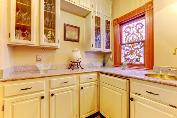 White kitchen pantry with antique cabinets and window. — Stock Photo, Image