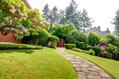 Spring garden and pathway near home. American Northwest. clipart