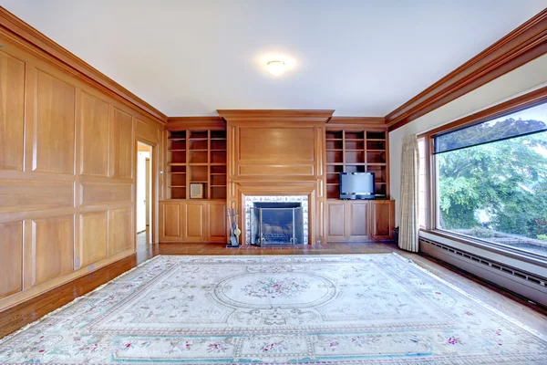 Home office with fireplace and wood walls in luxury old Ameican house. — Stock Photo, Image