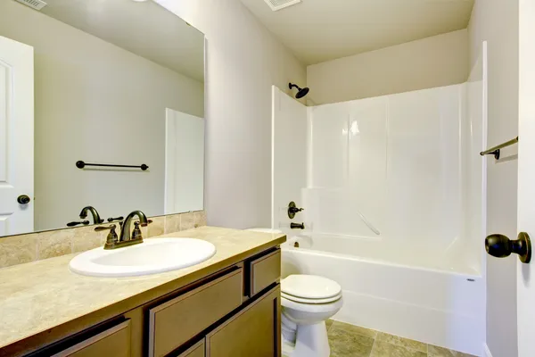 New home bathroom with shower and bath. — Stock Photo, Image