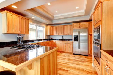 Bright wood kitchen with coffered ceiling clipart