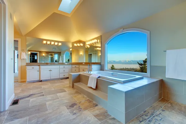 Luxuriant bathroom with whirlpool and amazing window view — Stock Image Luxuriant bathroom with whirlpool and amazing window view Stock Image