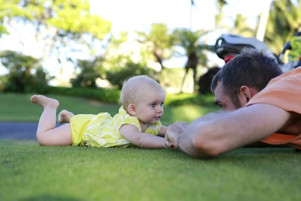 Cute baby is playing with father — Stock Photo, Image