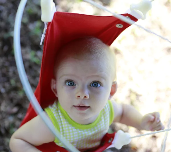 Excited baby girl in the jumper — Stock Photo, Image