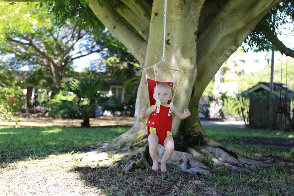 Excited baby girl in the jumper — Stock Photo, Image