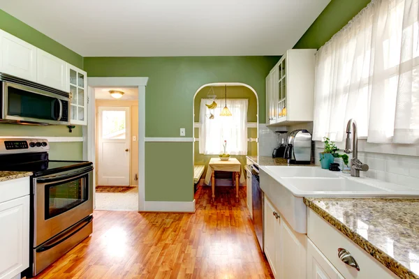 Green kitchen room with dining area — Stock Photo, Image