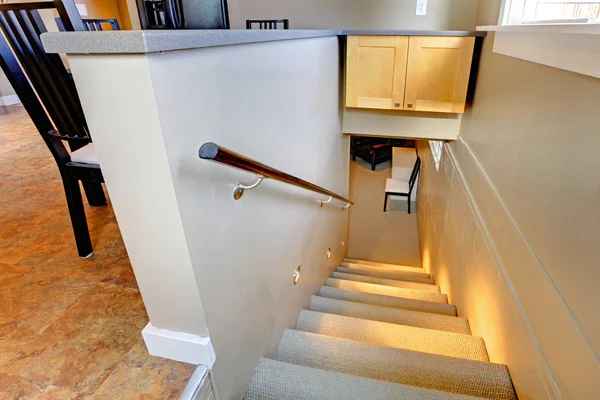 Staircase to the basement with lights on — Stock Photo, Image