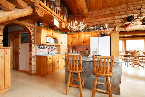 Kitchen room in log cabin house — Stock Photo, Image