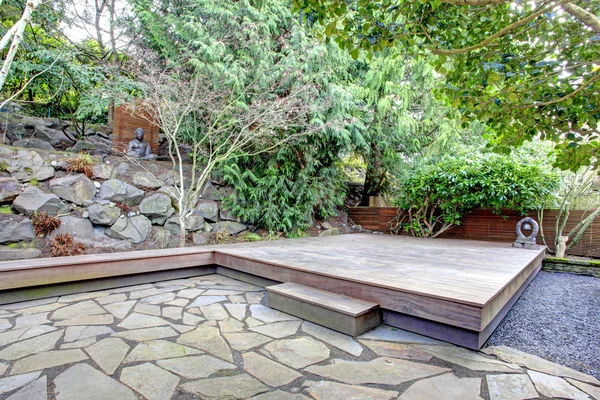 Tropical back yard with a wooden deck — Stock Photo, Image