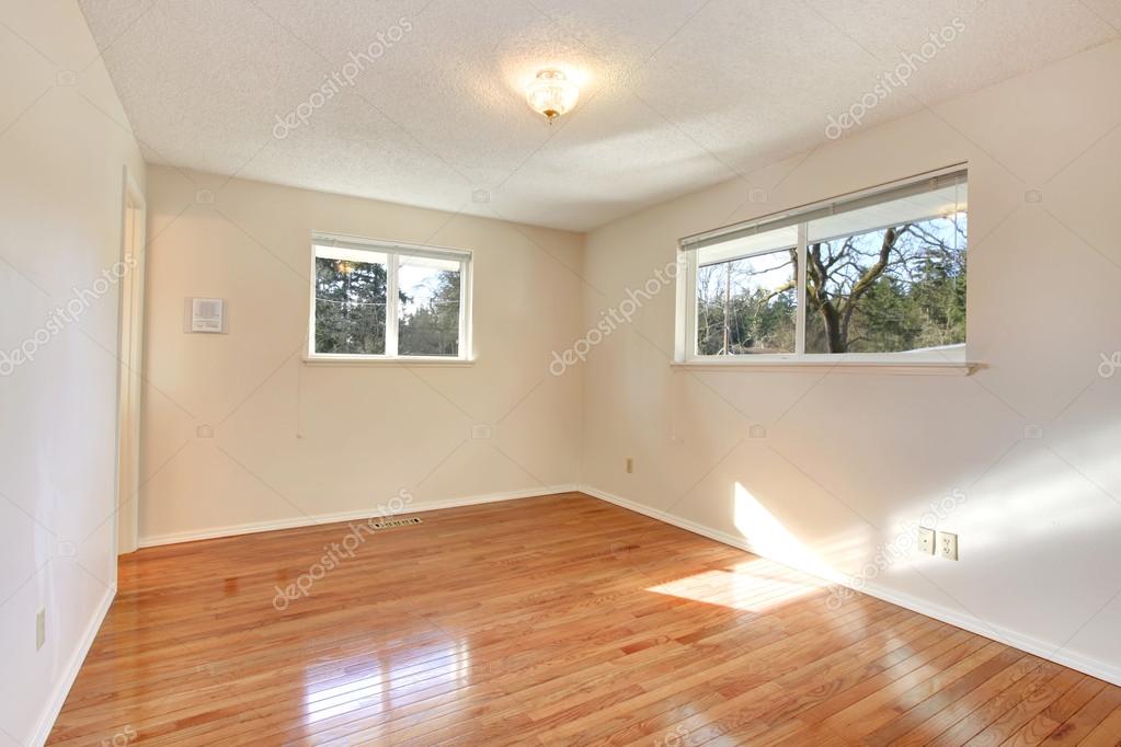 Warn Colors Empty Room With Two Small Windows Stock Photo Warn Colors Empty Room With Two Small Windows And Hardwood Floor Photo By Iriana88w