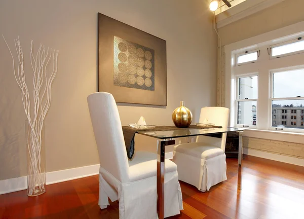 Elegant dining table set in a modern living room Stock Picture