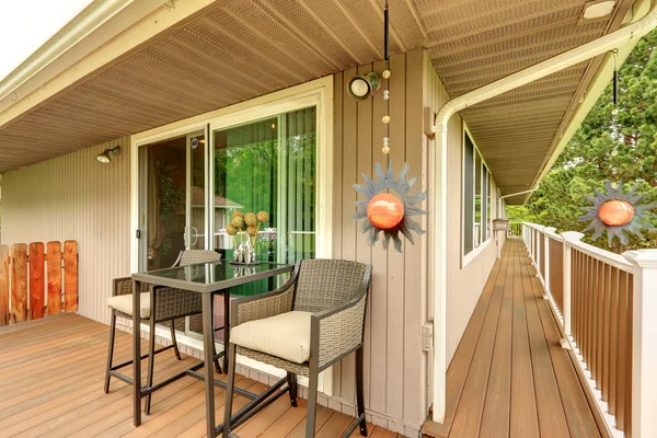 Walkout deck with wicker table set — Stock Photo, Image