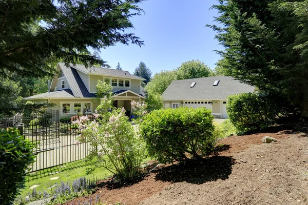 View of nice house with blooming bushes — Stock Photo, Image