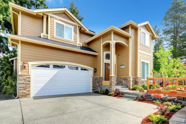 Big house with high porch and stone trim clipart