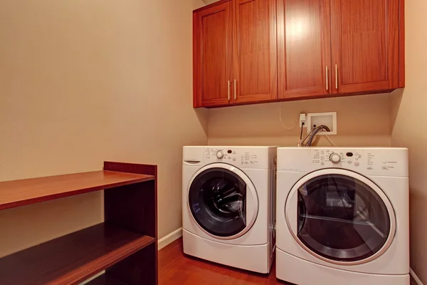 Small laundry room with modern appliances — Stock Photo, Image