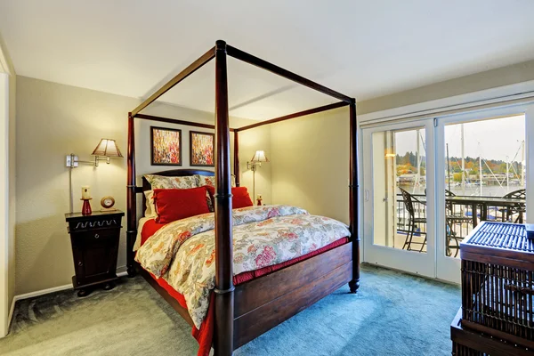 Bedroom interior with high poles bed — Stock Photo, Image