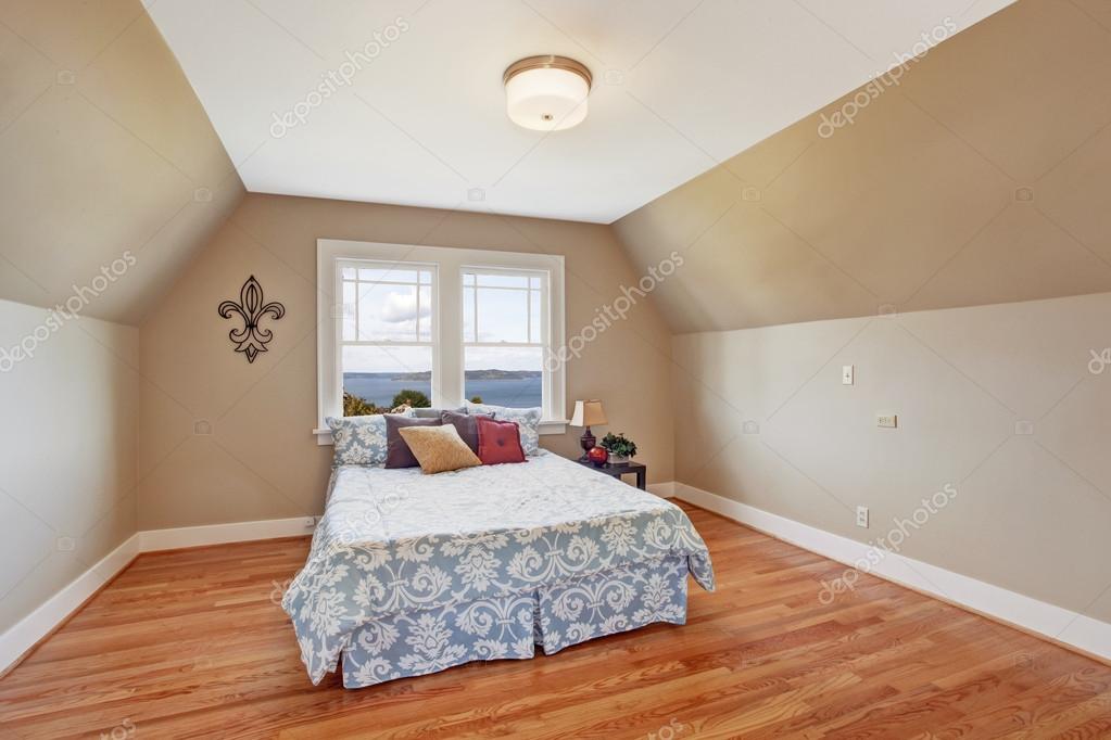 Cozy Bedroom Interior With Vaulted Ceiling Stock Photo