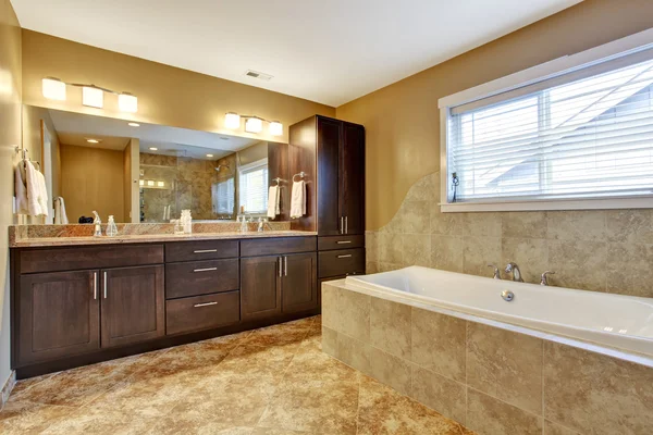 Modern bathroom interior with dark brown cabinets — Stock Photo, Image